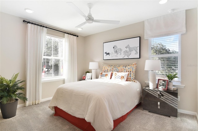 carpeted bedroom with baseboards and ceiling fan