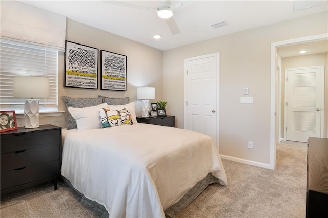 bedroom featuring light colored carpet, a ceiling fan, baseboards, and recessed lighting