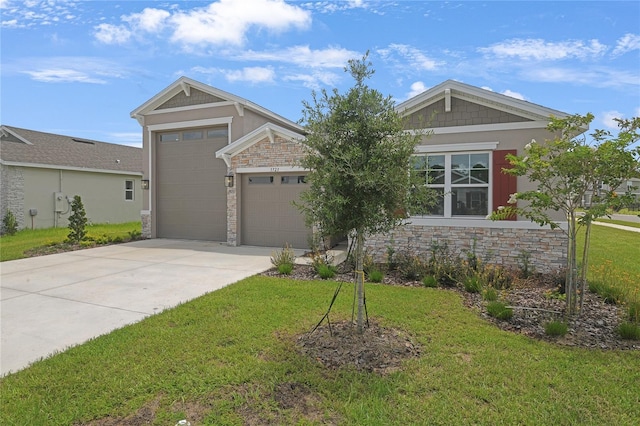 3723 Malad Way, Tavares, FL 32778 - craftsman-style house with a front lawn, stone siding, and concrete driveway