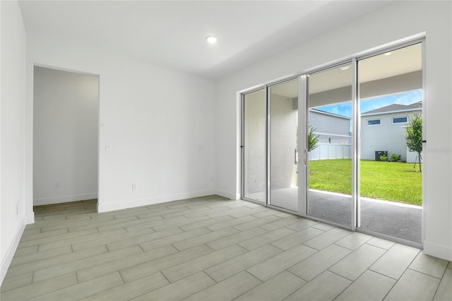 3723 Malad Way, Tavares, FL 32778 - empty room featuring light wood finished floors and recessed lighting