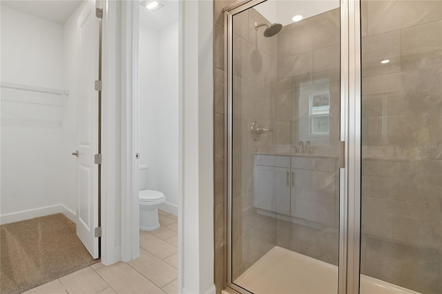 3723 Malad Way, Tavares, FL 32778 - full bath with a stall shower, a walk in closet, and tile patterned floors