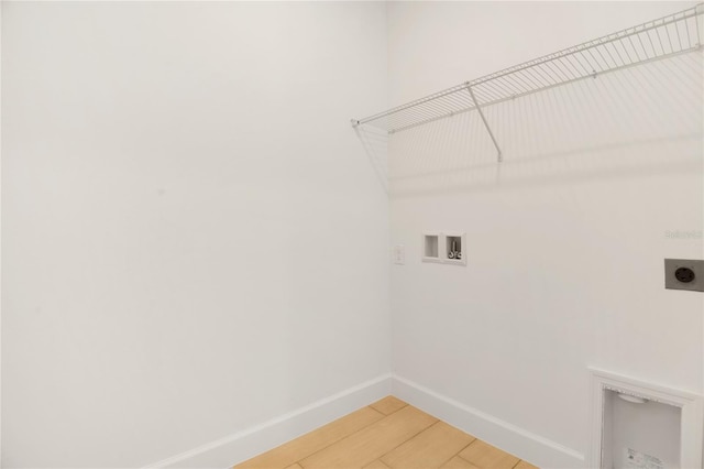 3723 Malad Way, Tavares, FL 32778 - laundry area with electric dryer hookup, washer hookup, and light wood-style floors