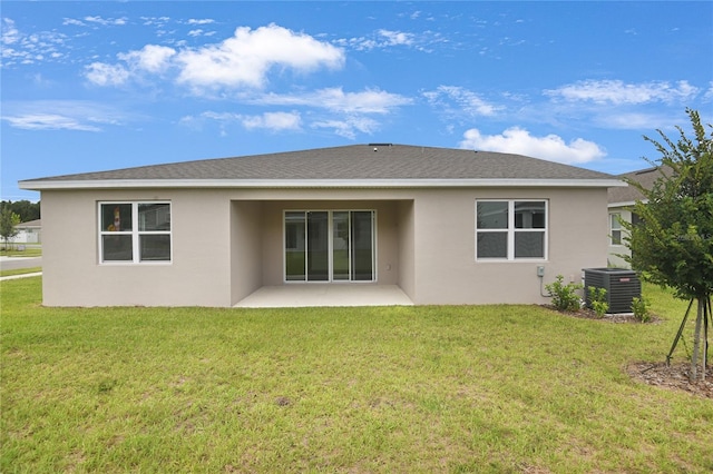 3723 Malad Way, Tavares, FL 32778 - back of house featuring stucco siding, a patio area, and a lawn