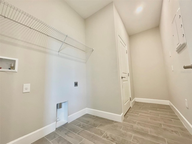 1001 Umbria Dr, Poinciana, FL 34759 - washroom with hookup for an electric dryer, wood finish floors, and washer hookup