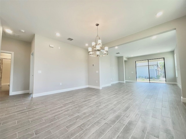 1001 Umbria Dr, Poinciana, FL 34759 - empty room featuring recessed lighting, a chandelier, light wood finished floors, and a smoke detector