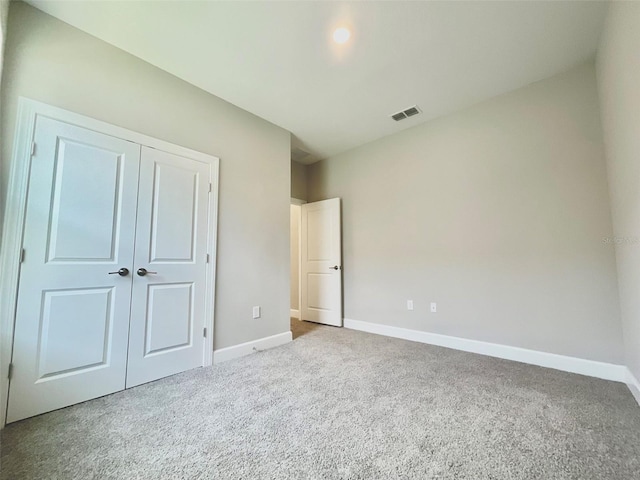 1001 Umbria Dr, Poinciana, FL 34759 - unfurnished bedroom with carpet floors and a closet