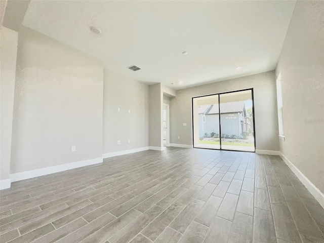1001 Umbria Dr, Poinciana, FL 34759 - empty room with light wood-style flooring and recessed lighting