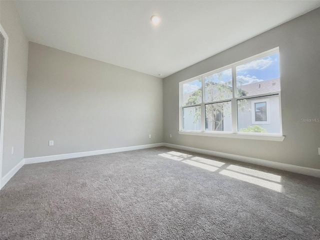 1001 Umbria Dr, Poinciana, FL 34759 - carpeted spare room featuring baseboards