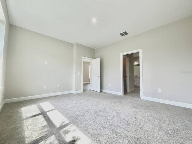 1001 Umbria Dr, Poinciana, FL 34759 - unfurnished bedroom featuring carpet floors and connected bathroom