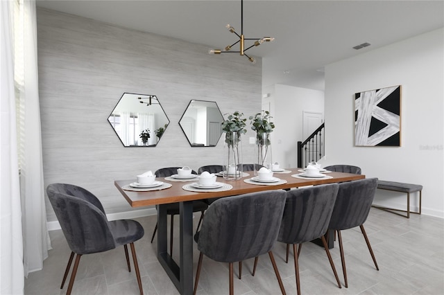 4290 Paragraph Dr, Kissimmee, FL 34746 - dining area with a chandelier and stairs