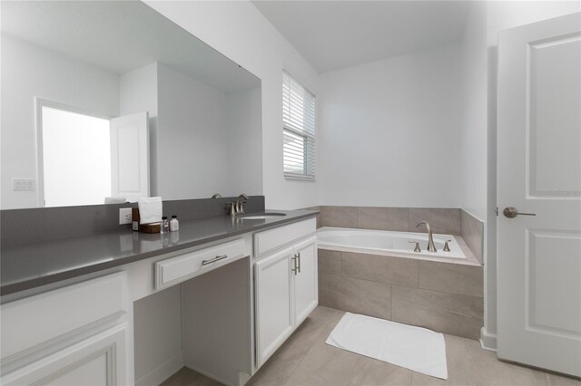 4290 Paragraph Dr, Kissimmee, FL 34746 - full bathroom featuring a garden tub, vanity, and tile patterned flooring