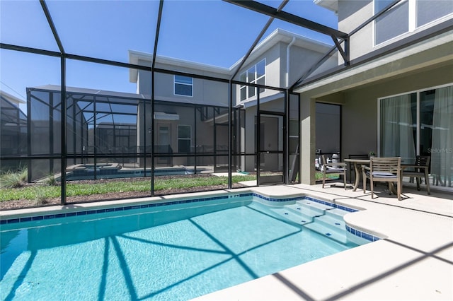 4290 Paragraph Dr, Kissimmee, FL 34746 - outdoor pool featuring a lanai and a patio area