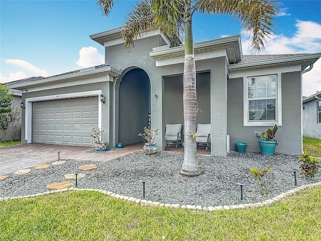 140 Trinity Ridge Cir, Davenport, FL 33897 - view of front of home with stucco siding, an attached garage, and driveway