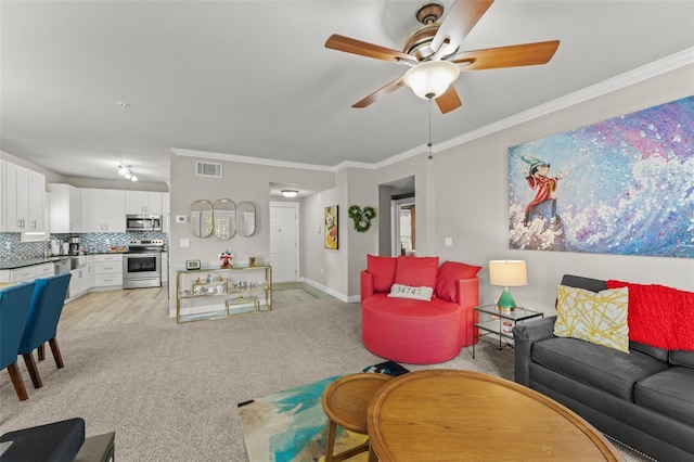 438 Water St Unit 438, Celebration, FL 34747 - living room with a ceiling fan, light carpet, and ornamental molding