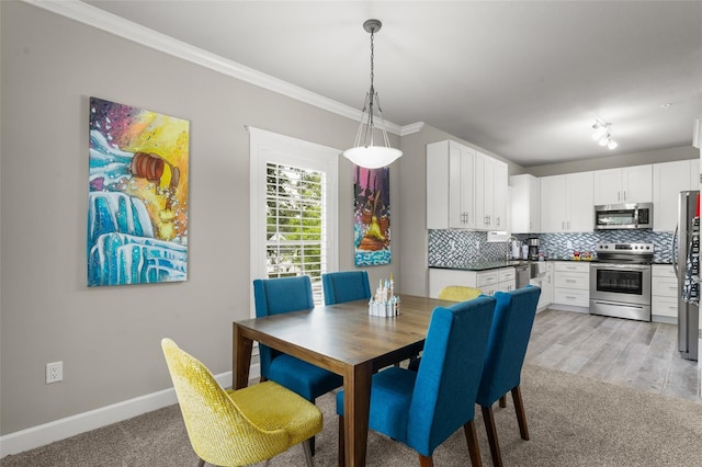 438 Water St Unit 438, Celebration, FL 34747 - dining space with ornamental molding and light carpet