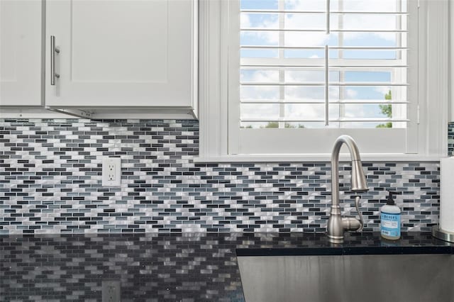 438 Water St Unit 438, Celebration, FL 34747 - kitchen view of white cabinets and decorative backsplash