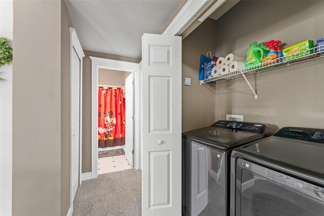 438 Water St Unit 438, Celebration, FL 34747 - laundry area featuring washer and clothes dryer, carpet flooring, and a textured ceiling