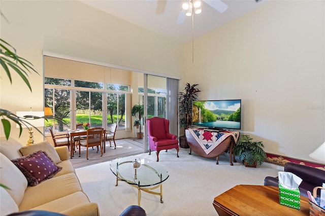 124 Ashton Dr, Davenport, FL 33837 - living room featuring carpet, plenty of natural light, a ceiling fan, and high vaulted ceiling