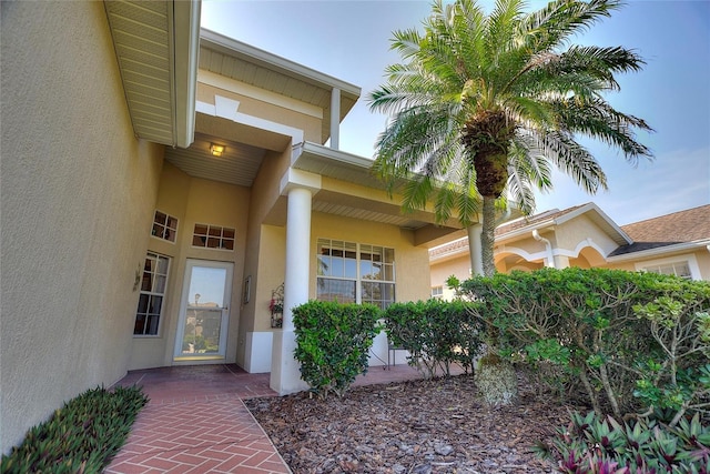 124 Ashton Dr, Davenport, FL 33837 - doorway to property with stucco siding