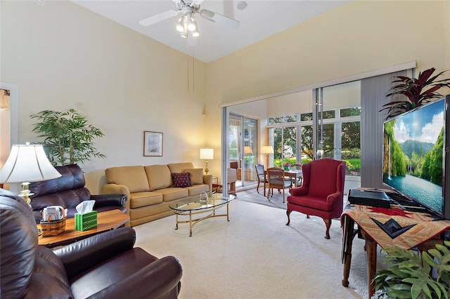 124 Ashton Dr, Davenport, FL 33837 - living room featuring carpet floors, a ceiling fan, and a high ceiling