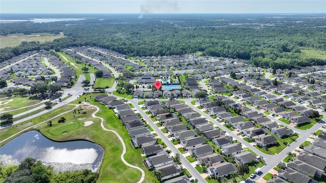 124 Ashton Dr, Davenport, FL 33837 - aerial view of property and surrounding area featuring a nearby body of water, nearby suburban area, a local golf course, and a forest