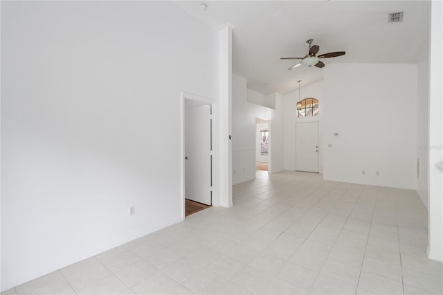3370 Cypress Point Cir, Saint Cloud, FL 34772 - empty room with high vaulted ceiling and ceiling fan