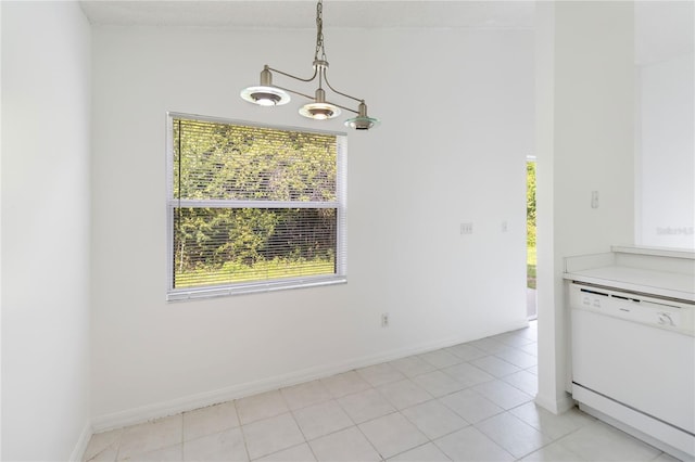 3370 Cypress Point Cir, Saint Cloud, FL 34772 - unfurnished dining area featuring a chandelier, light tile patterned flooring, and baseboards