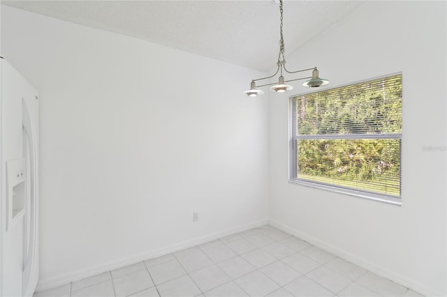 3370 Cypress Point Cir, Saint Cloud, FL 34772 - unfurnished dining area with a chandelier, baseboards, vaulted ceiling, and light tile patterned floors