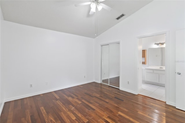 3370 Cypress Point Cir, Saint Cloud, FL 34772 - unfurnished bedroom featuring wood finished floors, a closet, baseboards, ensuite bath, and ceiling fan