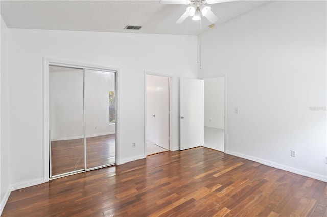 3370 Cypress Point Cir, Saint Cloud, FL 34772 - unfurnished bedroom featuring wood finished floors, baseboards, ceiling fan, a closet, and high vaulted ceiling