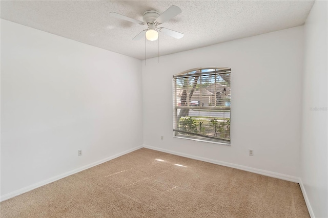 3370 Cypress Point Cir, Saint Cloud, FL 34772 - unfurnished room featuring a textured ceiling, carpet floors, a ceiling fan, and baseboards