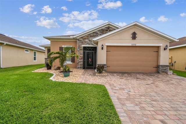 1272 Bonita Canyon Dr, Kissimmee, FL 34759 - single story home with stone siding, stucco siding, decorative driveway, and a front lawn