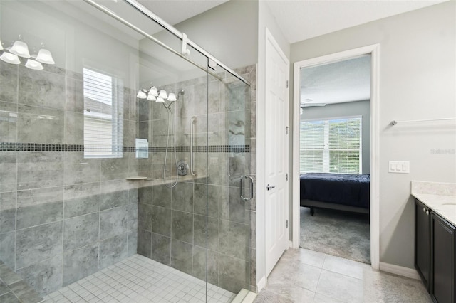 1272 Bonita Canyon Dr, Kissimmee, FL 34759 - full bath featuring vanity, tile patterned floors, connected bathroom, a stall shower, and baseboards