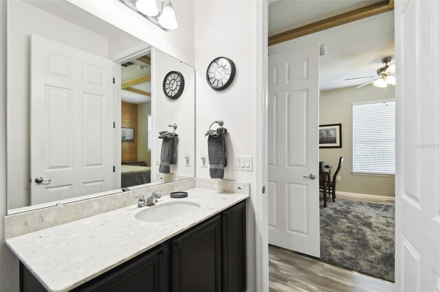 1272 Bonita Canyon Dr, Kissimmee, FL 34759 - bathroom with wood finished floors, vanity, ceiling fan, connected bathroom, and baseboards