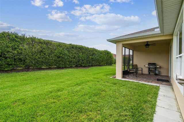 1272 Bonita Canyon Dr, Kissimmee, FL 34759 - view of grassy yard with ceiling fan and a patio