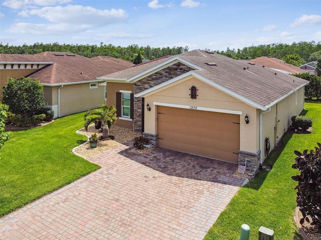 1272 Bonita Canyon Dr, Kissimmee, FL 34759 - single story home featuring stucco siding, stone siding, and a garage