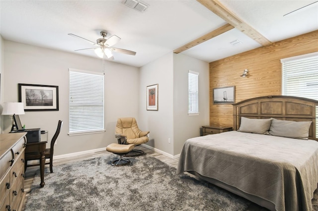 1272 Bonita Canyon Dr, Kissimmee, FL 34759 - bedroom with baseboards, multiple windows, wood walls, and ceiling fan