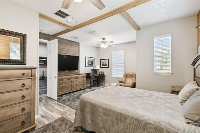 1272 Bonita Canyon Dr, Kissimmee, FL 34759 - bedroom featuring light wood-type flooring, beam ceiling, a desk, and ceiling fan