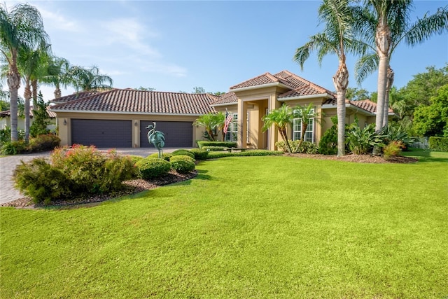 7 Spanish Moss Ct, Palm Coast, FL 32137 - mediterranean / spanish-style house with a tile roof, driveway, stucco siding, and a front lawn