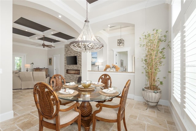 7 Spanish Moss Ct, Palm Coast, FL 32137 - dining area with stone tile floors, beam ceiling, coffered ceiling, ornamental molding, and baseboards