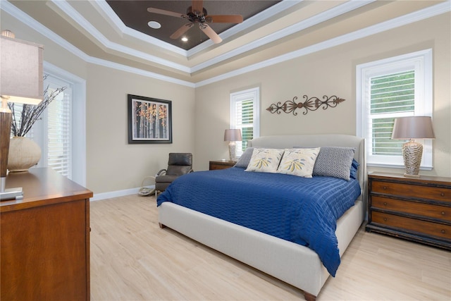 7 Spanish Moss Ct, Palm Coast, FL 32137 - bedroom with a raised ceiling, light wood-style floors, ornamental molding, baseboards, and a ceiling fan