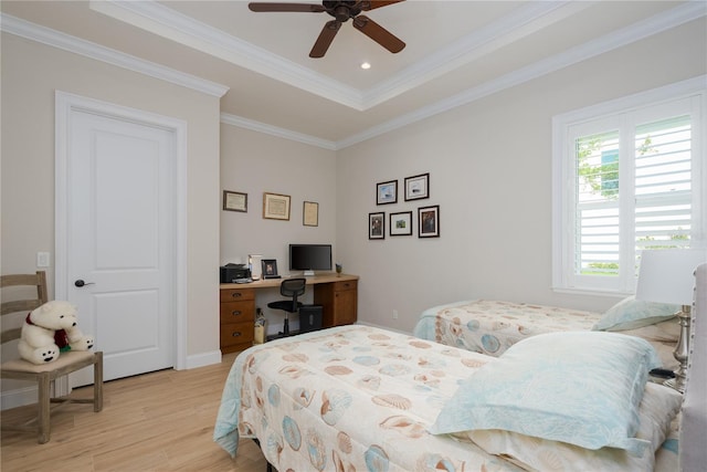 7 Spanish Moss Ct, Palm Coast, FL 32137 - bedroom featuring light wood-type flooring, crown molding, a tray ceiling, and ceiling fan