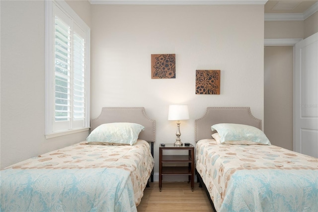 7 Spanish Moss Ct, Palm Coast, FL 32137 - bedroom featuring multiple windows, wood finished floors, and crown molding