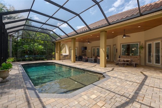 7 Spanish Moss Ct, Palm Coast, FL 32137 - outdoor pool with french doors, ceiling fan, a patio, and a lanai