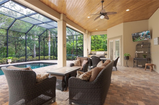 7 Spanish Moss Ct, Palm Coast, FL 32137 - view of patio / terrace featuring french doors, an outdoor pool, ceiling fan, outdoor lounge area, and glass enclosure