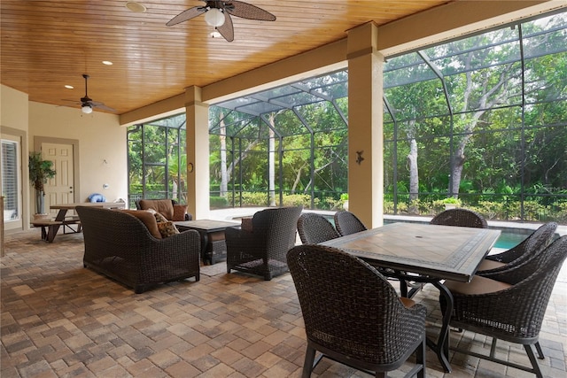 7 Spanish Moss Ct, Palm Coast, FL 32137 - view of patio / terrace featuring ceiling fan, glass enclosure, and an outdoor living space