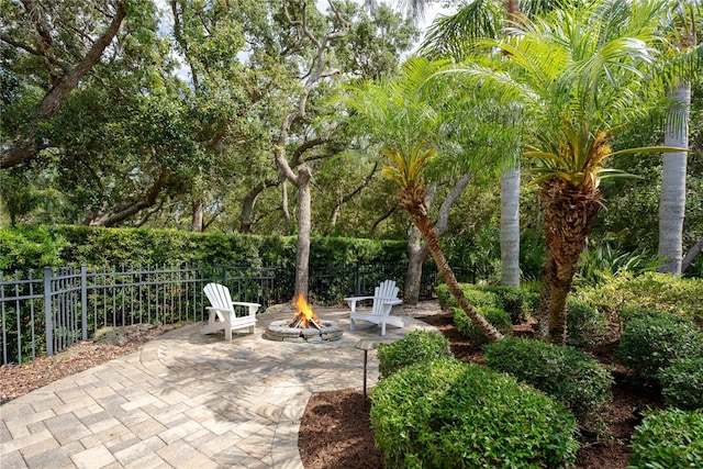 7 Spanish Moss Ct, Palm Coast, FL 32137 - view of patio / terrace featuring an outdoor fire pit