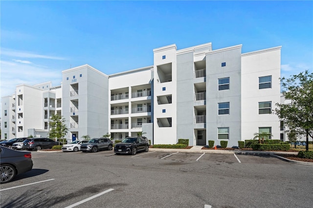 3150 Paradox Cir Unit 104, Kissimmee, FL 34746 - view of apartment building / complex featuring uncovered parking