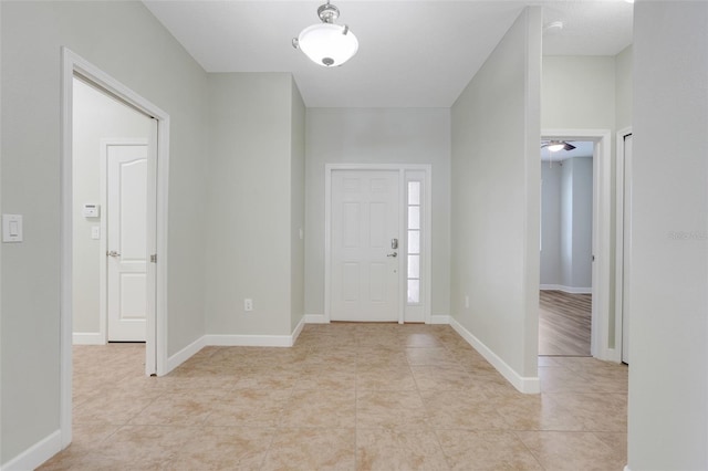 1300 Island Green St, Davenport, FL 33896 - foyer with light tile patterned floors and baseboards