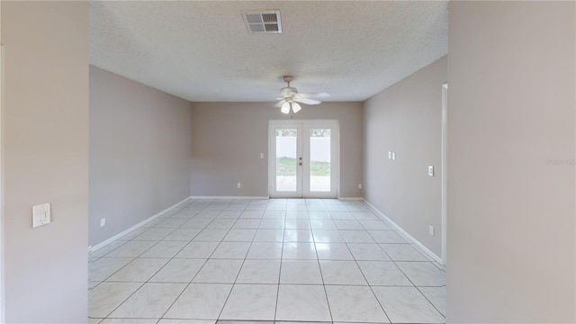 114 N Alderwood St, Winter Springs, FL 32708 - unfurnished room with a ceiling fan, a textured ceiling, french doors, baseboards, and light tile patterned floors